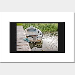 Boat tied to wooden staging on the Norfolk Broads Posters and Art